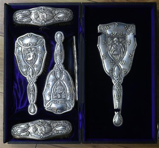 An Edwardian Art Nouveau repousse silver six piece set, by Levi & Salaman, Birmingham, 1904, in Coombs Ltd, Rangoon, box